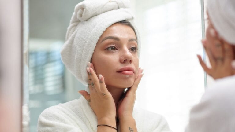 Woman applying at-home chemical peel to face