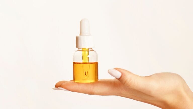 Exfoliating toner and serum bottles side by side showing concentration difference