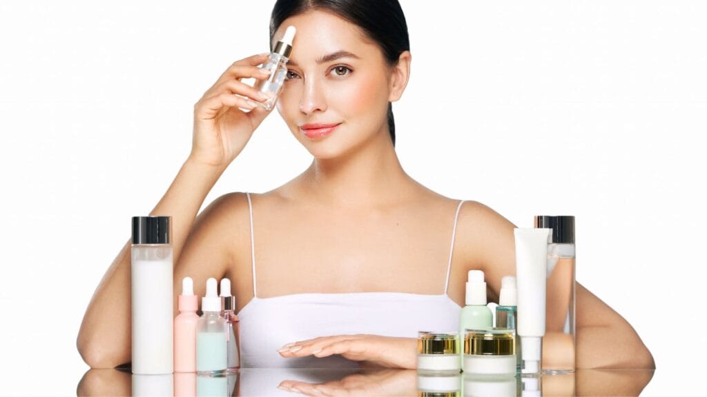 Retinol serum, niacinamide, vitamin C and AHA skincare products arranged on a white surface